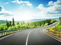 image of windy road surrounded by landscape