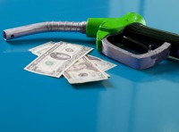 image of gas pump with money