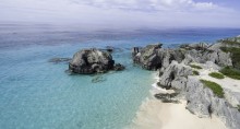 image of beach with bolder rocks to the right
